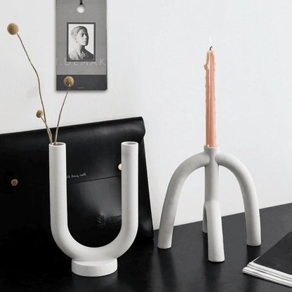 Suporturi pentru lumânări subțiri cu forme curbe scandinave