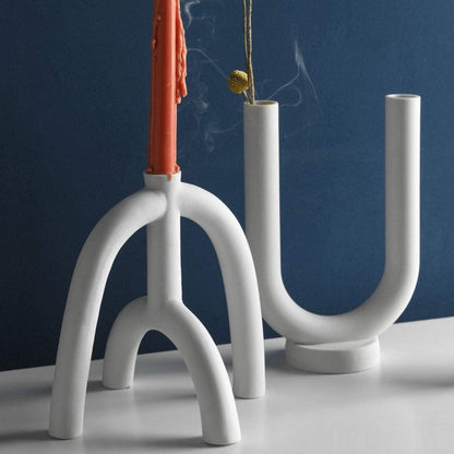 Suporturi pentru lumânări subțiri cu forme curbe scandinave