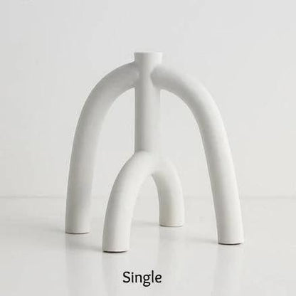 Suporturi pentru lumânări subțiri cu forme curbe scandinave